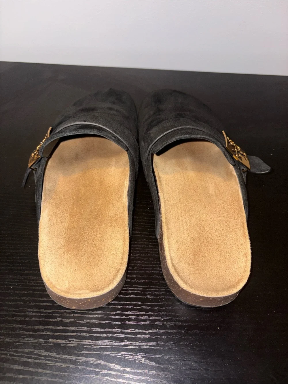 Tory Burch black suede slip-on mules in a size 7.5